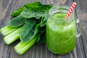 Green Smoothie on Clear Glass With Straw 