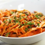 Red Lentil Pasta On A White Bowl