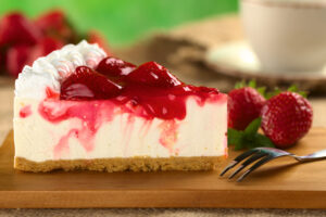 Slice Vegan Cheesecake with Strawberry jam on Top